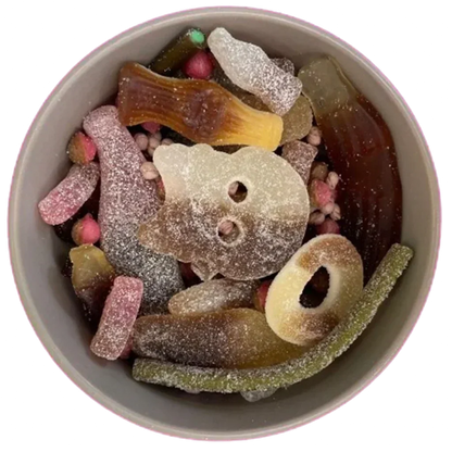 A bowl filled with a variety of sugar-coated gummy sweets and candies.