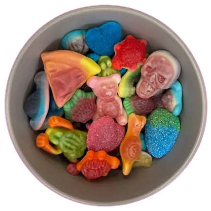 A grey bowl filled with a variety of colorful gummy pick n mix sweets on a pink background.
